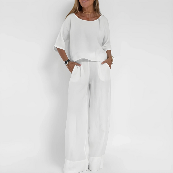 Comfortabele dames loungewear tweedelige set. Ademend polyester spandex, relaxte fit damestop en damesbroek met wijde pijpen.