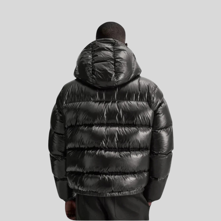 Stijlvolle en comfortabele gewatteerde heren winter pufferjas in zwart/groen voor koude dagen.