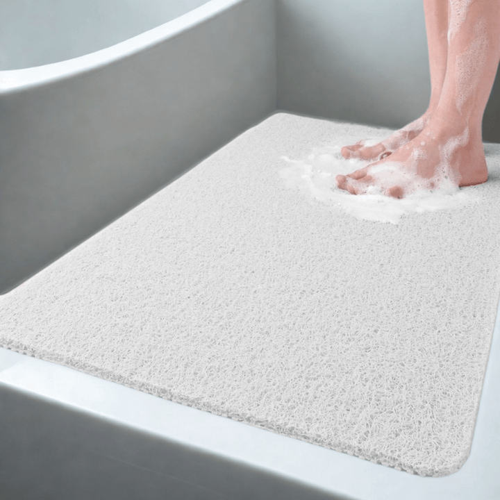 Levendige gele antislip douchemat met drainagesysteem, zorgt voor veiligheid en een hygiënische doucheruimte.