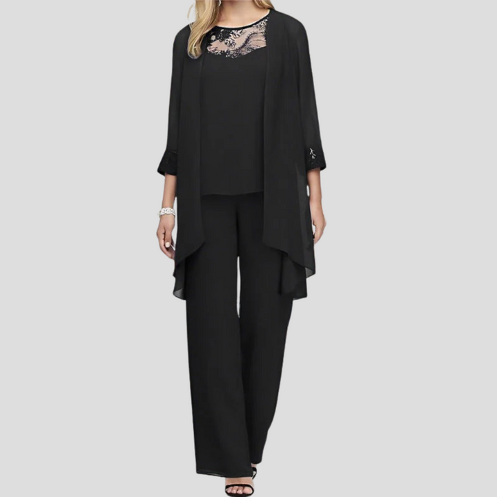 Elegante violette tweedelige dames set, bestaande uit een chique top en bijpassende broek, ideaal voor avondkleding.