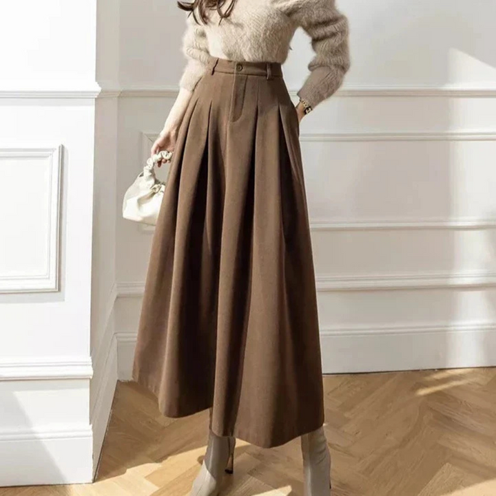 Modieuze dames midi rok, elegant en comfortabel, geschikt voor diverse gelegenheden. Beschikbaar in zwart/bruin.