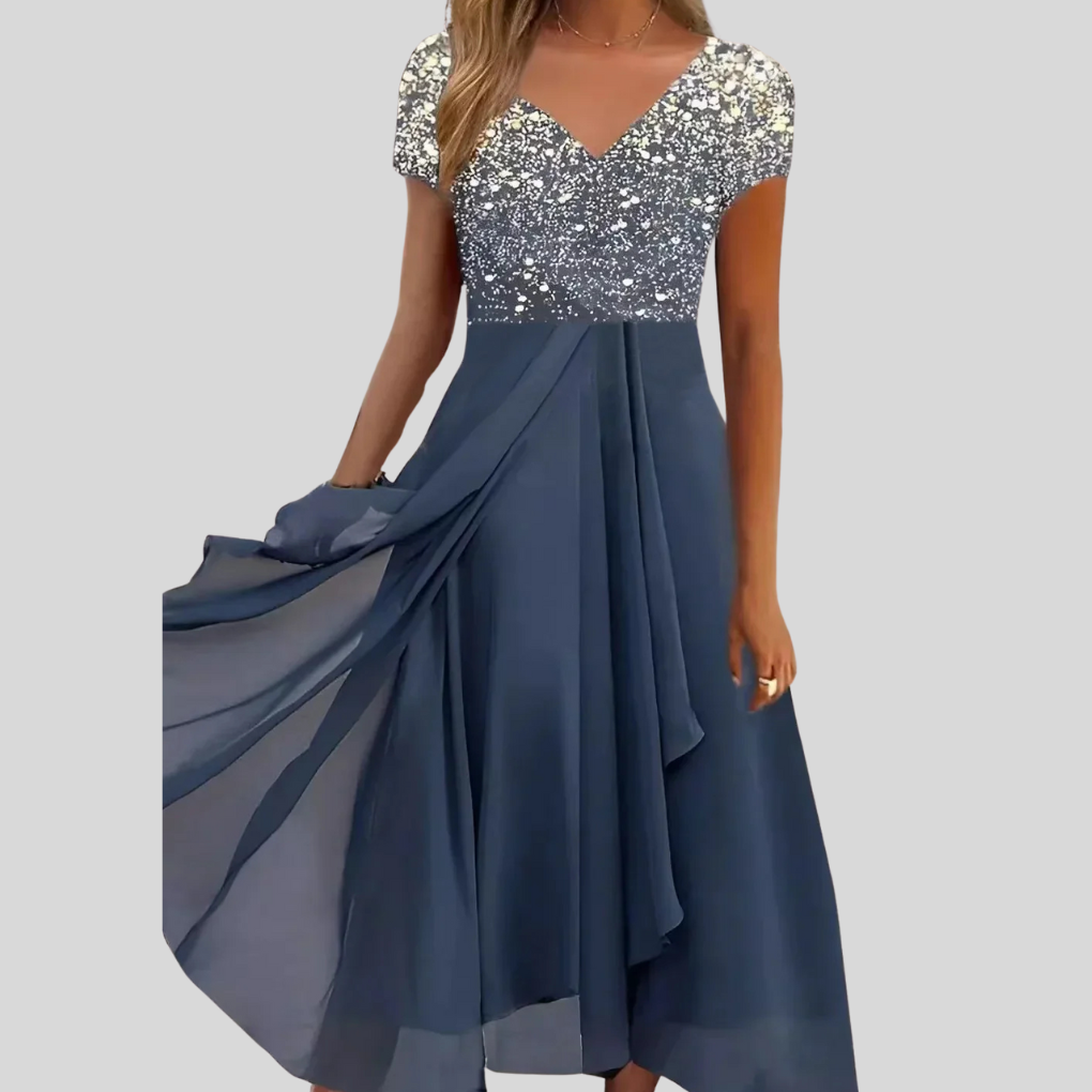 Stijlvolle midi damesjurk in elegante uitvoering, comfortabel en flatterend. Geschikt voor casual en feestelijke gelegenheden.