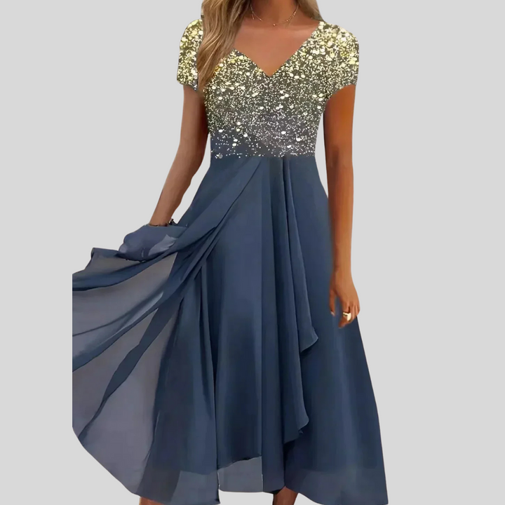 Comfortabele dames midi jurk in diverse kleuren, met een elegante en flatterende pasvorm. Ideaal voor zomer en lente.