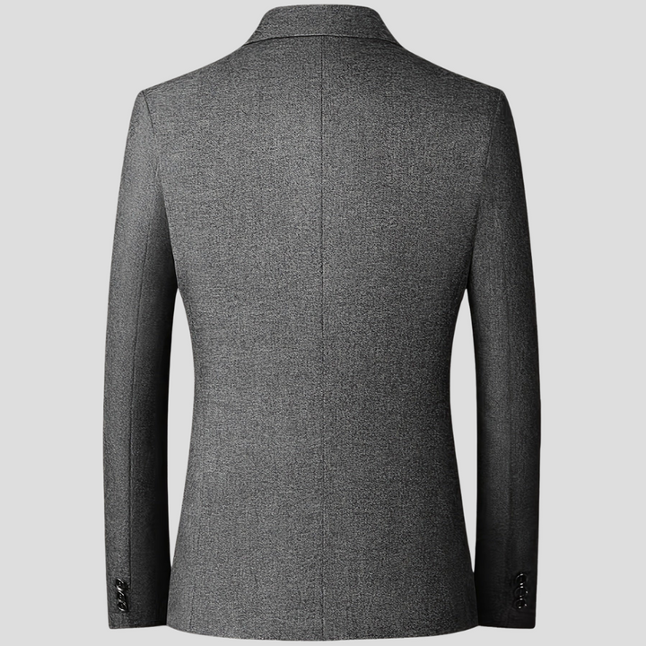 Donkergrijze heren colbert, formeel en toch veelzijdig, geschikt voor zakelijke kleding of vrije tijd.