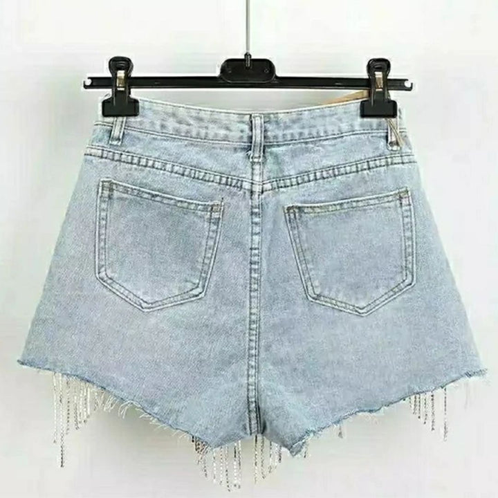 Dames roze korte broek van denim, high-waist model met glamoureuze diamantapplicaties, voor een trendy zomer.