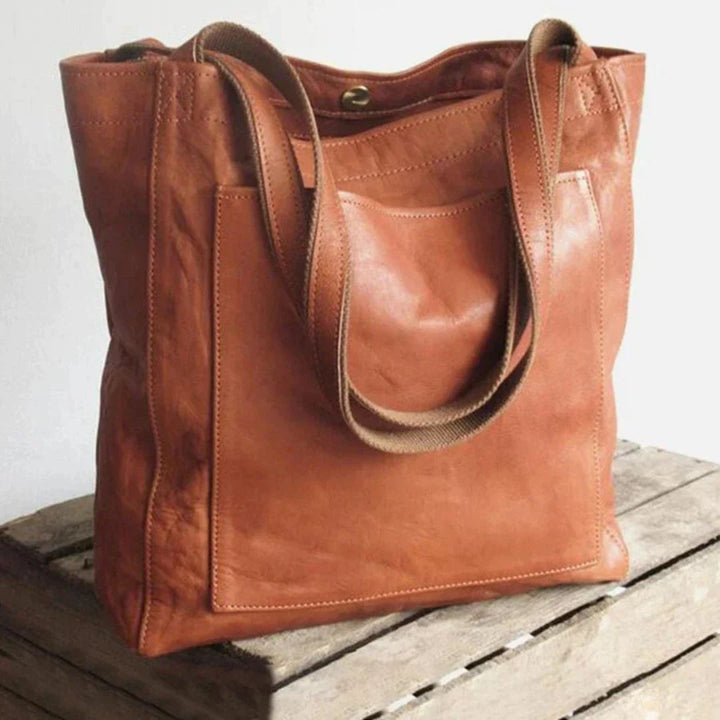 Chique leren dames handtas in chocoladekleur, perfect als elegante schoudertas. Luxe accessoire.