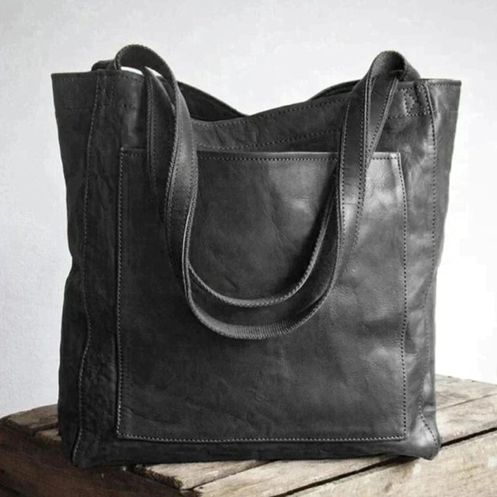 Elegante zwarte leren dames handtas, veelzijdig als chique schoudertas voor elke gelegenheid.