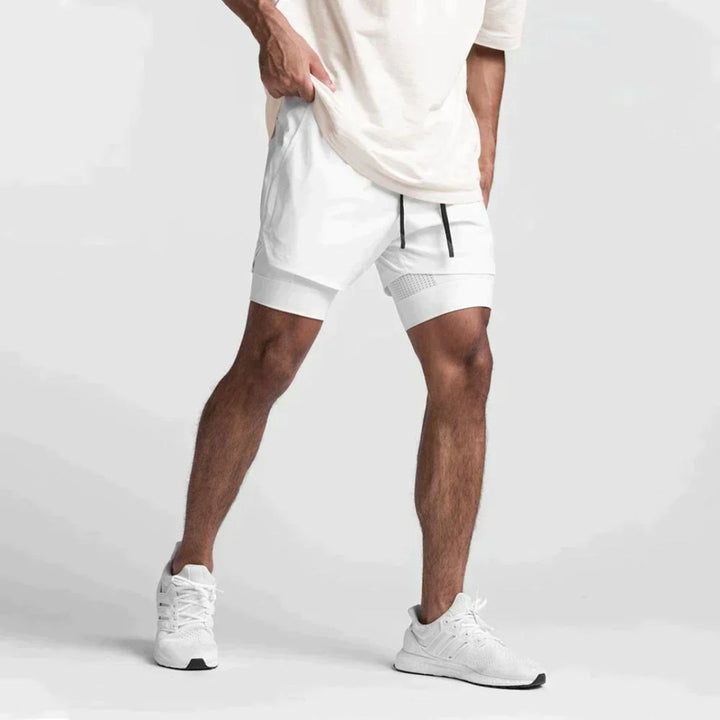 Detailopname van de comfortabele stof van de zwarte heren sportshort Carl, ideaal voor sport.