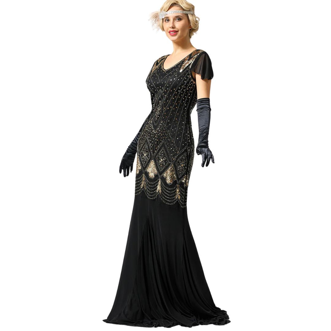 Volledige afbeelding van een elegante jaren '20 damesjurk, versierd met pailletten en franjes, voor een slank silhouet.
