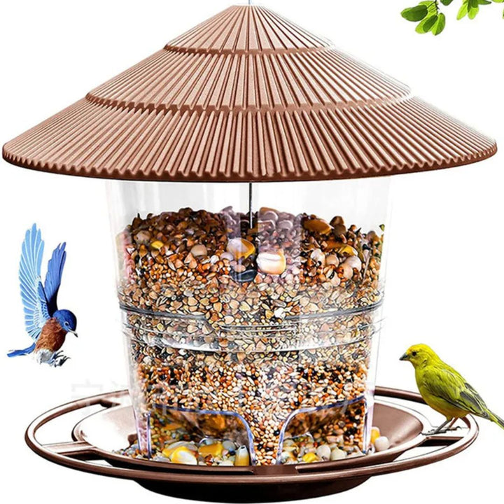 Transparante automatische vogelvoeder voor noten, ideaal voor tuinvogels in je tuin.