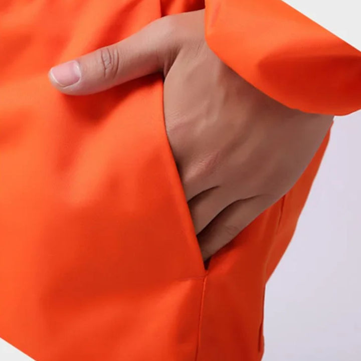 Stofvrije oranje veiligheidsoverall, robuust en comfortabel voor lange werkdagen.