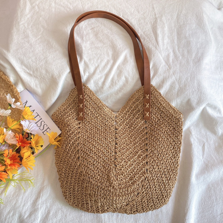 Stijlvolle witte dames schoudertas met geweven textuur. Perfecte accessoire, trendy en ruim voor strand of stad.