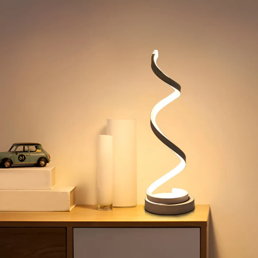 Dimbare moderne spiraal LED tafellamp LumaSpiral voor sfeervolle verlichting in interieur.