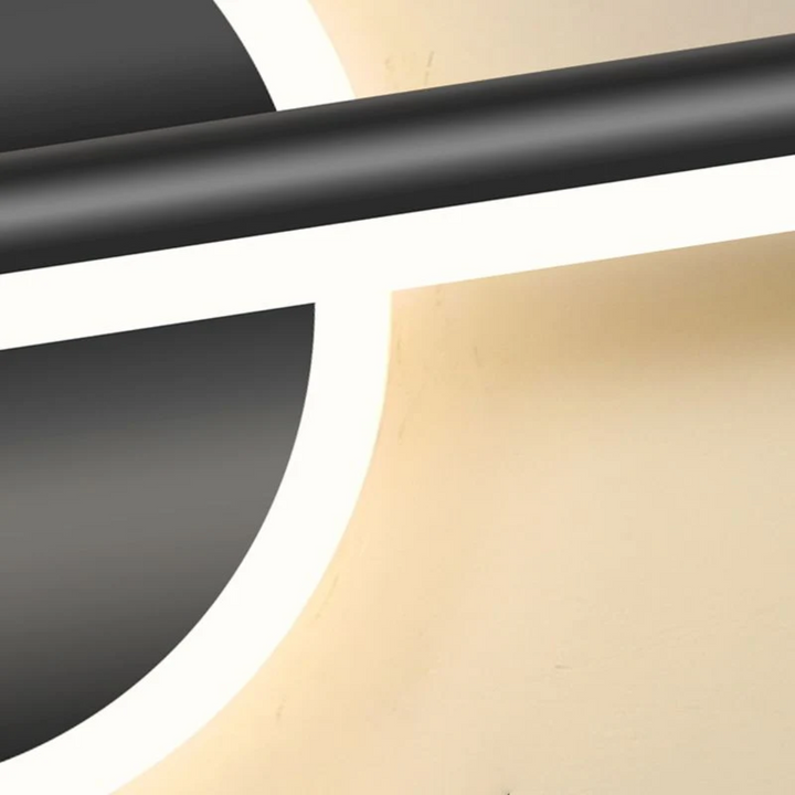 Goud-zwarte OpalEdge LED wandlamp. Geschikt als moderne sfeerverlichting in woonkamer of hal.