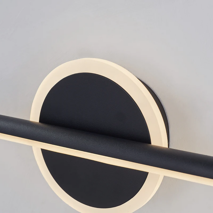 Detailopname OpalEdge LED wandlamp: strakke goud-zwarte afwerking. Perfecte sfeerverlichting.