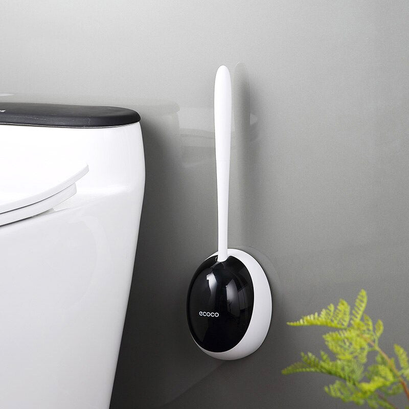 Moderne zwarte siliconen toiletborstel, flexibel en hygiënisch, met wandbevestigde houder.