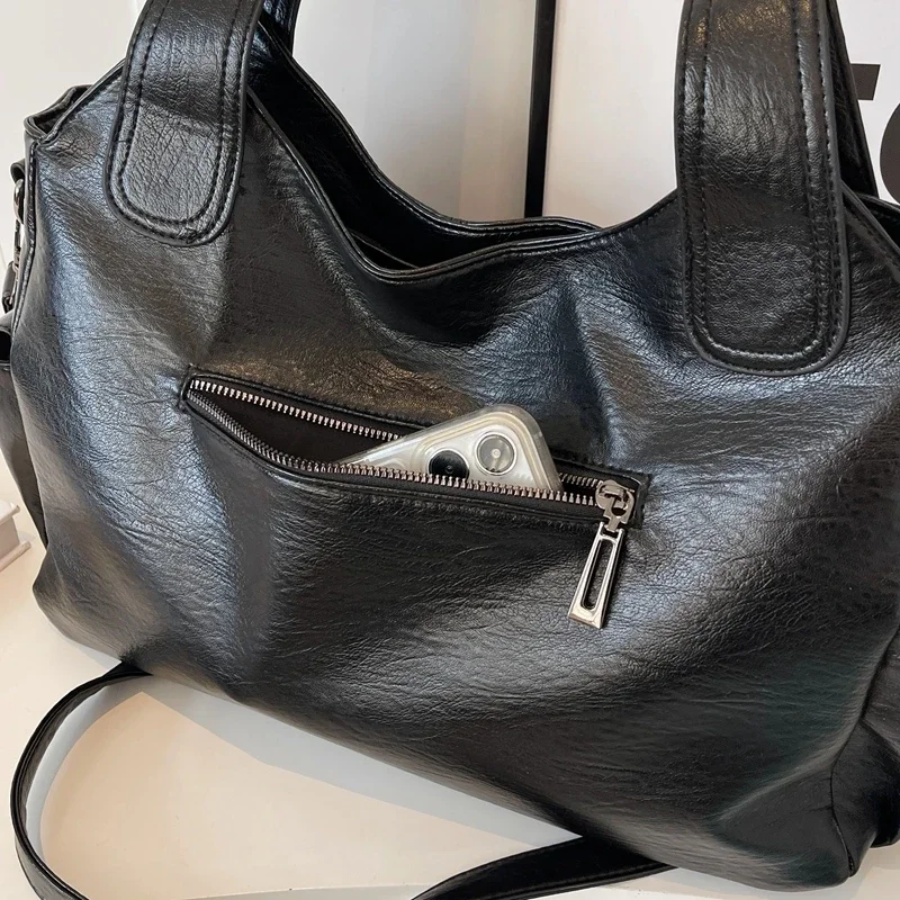 Elegante Nikita dames tas, een praktische crossbody met slimme indeling en veelzijdigheid.