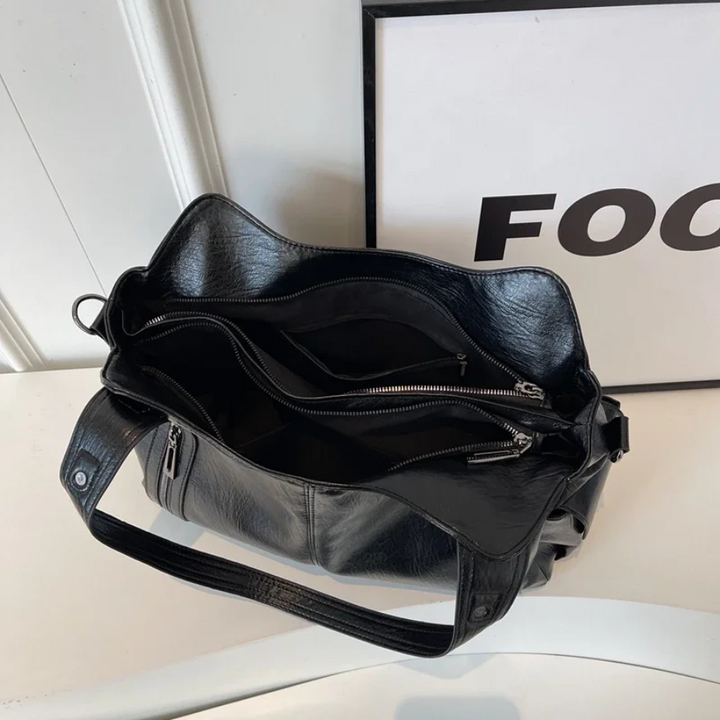 Praktische dames crossbody Nikita, georganiseerd en elegant voor elke gelegenheid.