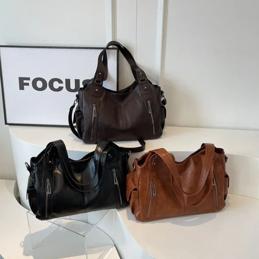 Nikita dames crossbody tas, dagelijks en modern, met slimme indeling en praktische vakken.