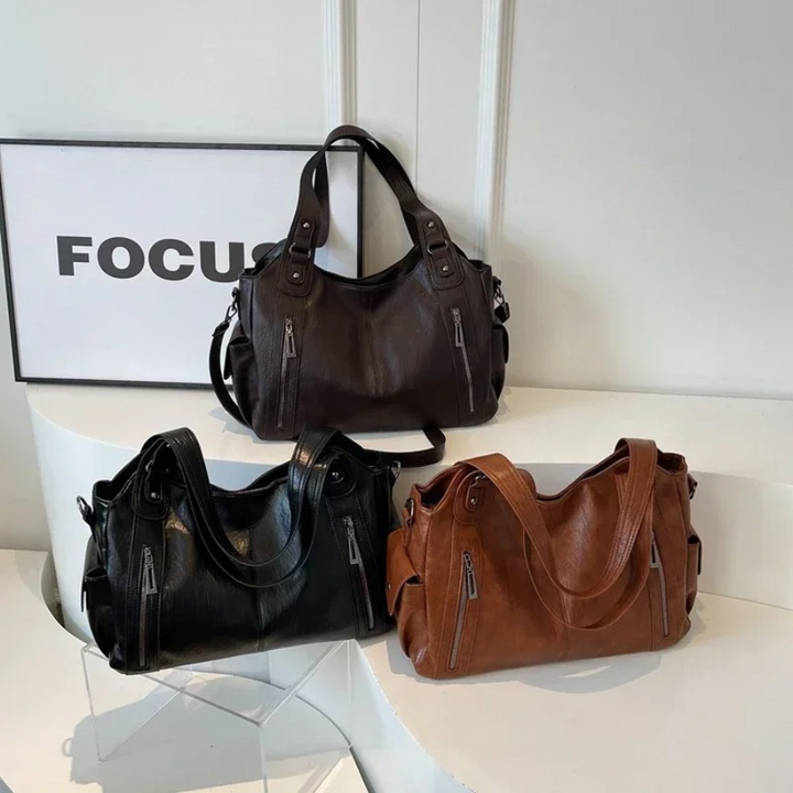 Nikita dames crossbody tas, dagelijks en modern, met slimme indeling en praktische vakken.