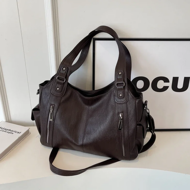 Praktische dames tas Nikita, een georganiseerde schoudertas en crossbody voor elke vrouw.