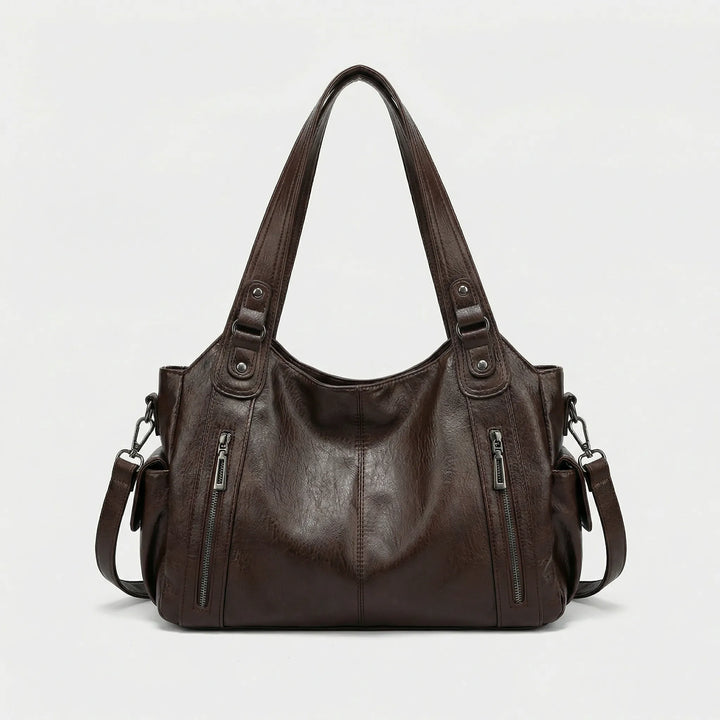 Modieuze bruine crossover tas voor dames, comfortabel te dragen, met handige compartimenten voor al je spullen.