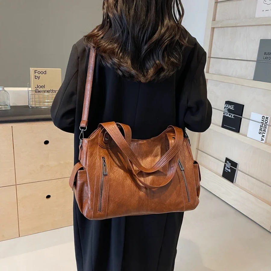 Dames crossbody tas Nikita, elegant en functioneel, met geordende vakken voor al je spullen.