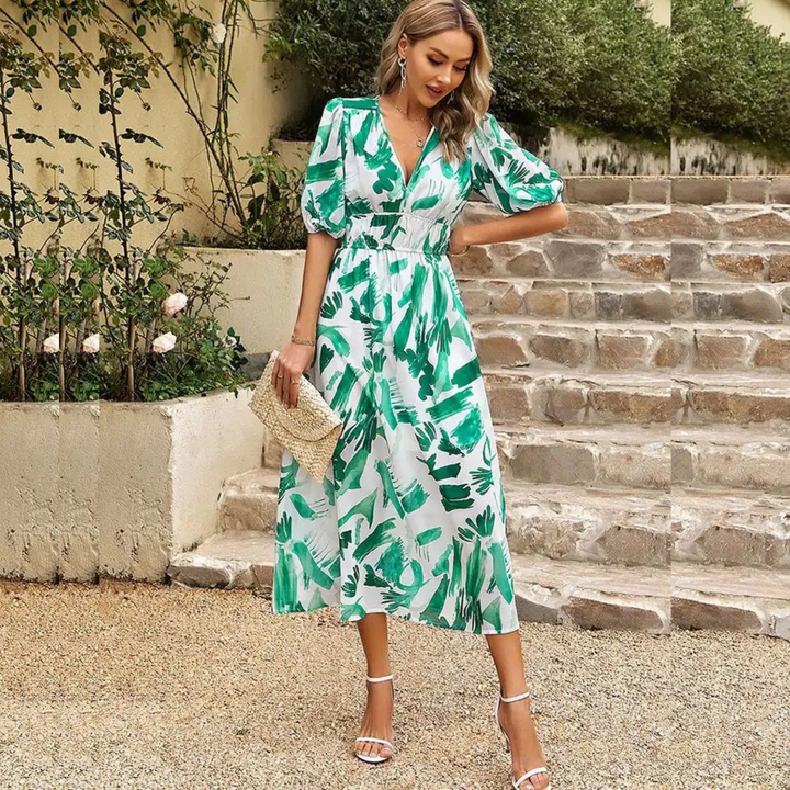 Veelzijdige dames midi zomerjurk, V-hals, elastische taille; geschikt als strandjurk of casual outfit.