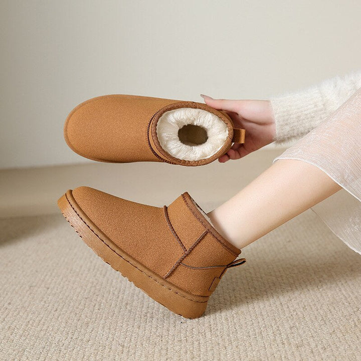 Elegante bruine leren dames winterlaarzen; bieden voetwarmte en ultiem comfort voor wintermode.
