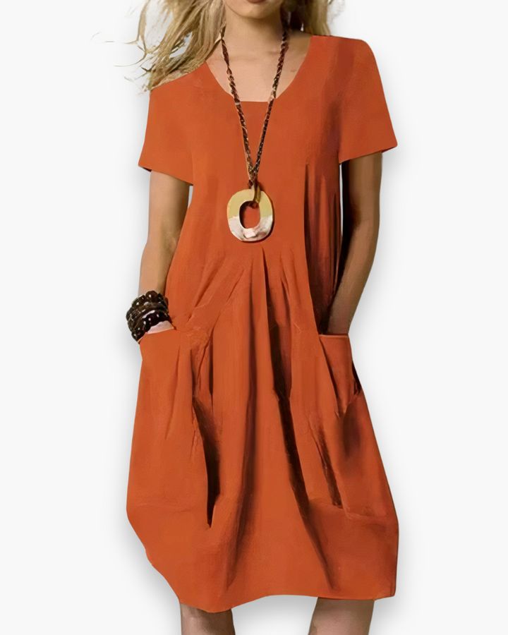 Comfortabele elegante dames midi-jurk voor de zomer, met losvallende pasvorm en praktische zakken.