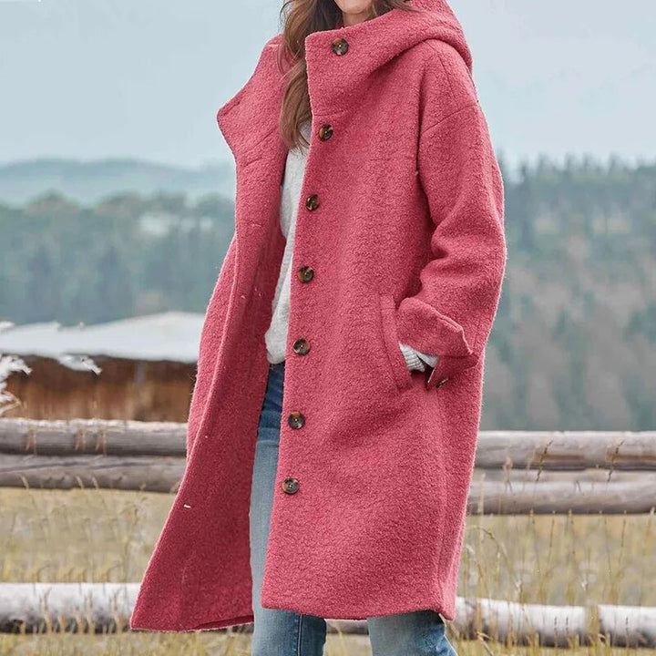 Elegante dames manteljas met capuchon, losvallend model, perfect voor een stijlvolle winterlook.