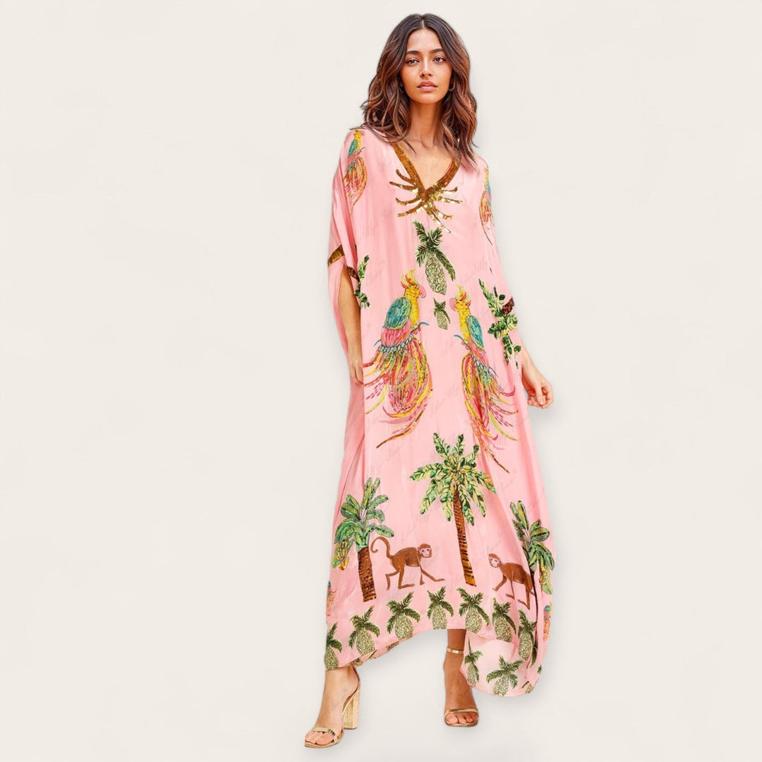 Veelzijdige dames kaftan met tropische print, geschikt als strandjurk of casual zomerjurk.