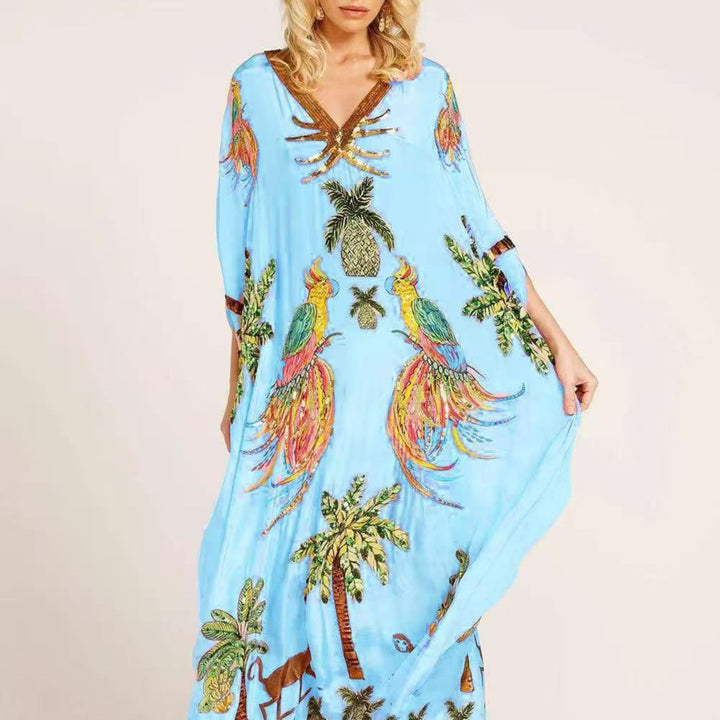 Opvallende tropische print kaftan voor dames, enkellang model. Een must-have voor de zomer.
