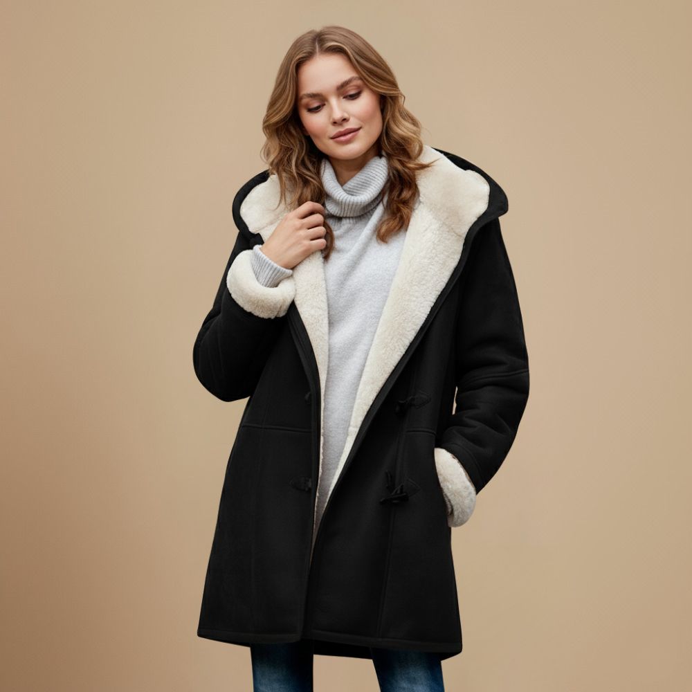 Modieuze dames winterjas met toggleknopen en capuchon. Essentieel voor wintermode.