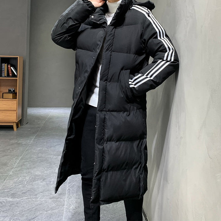 Warme gewatteerde heren winterjas, lang model, sportief en comfortabel. Geschikt voor alle winterse avonturen.