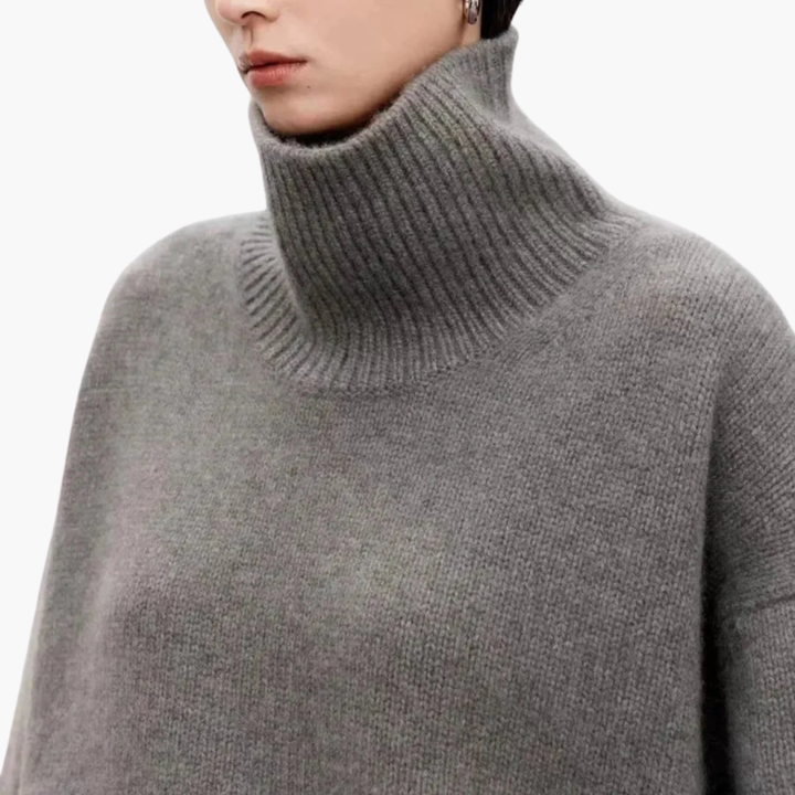 Gebreide dames oversized trui met warme hoge hals. Comfortabele en modieuze keuze voor de koude dagen.