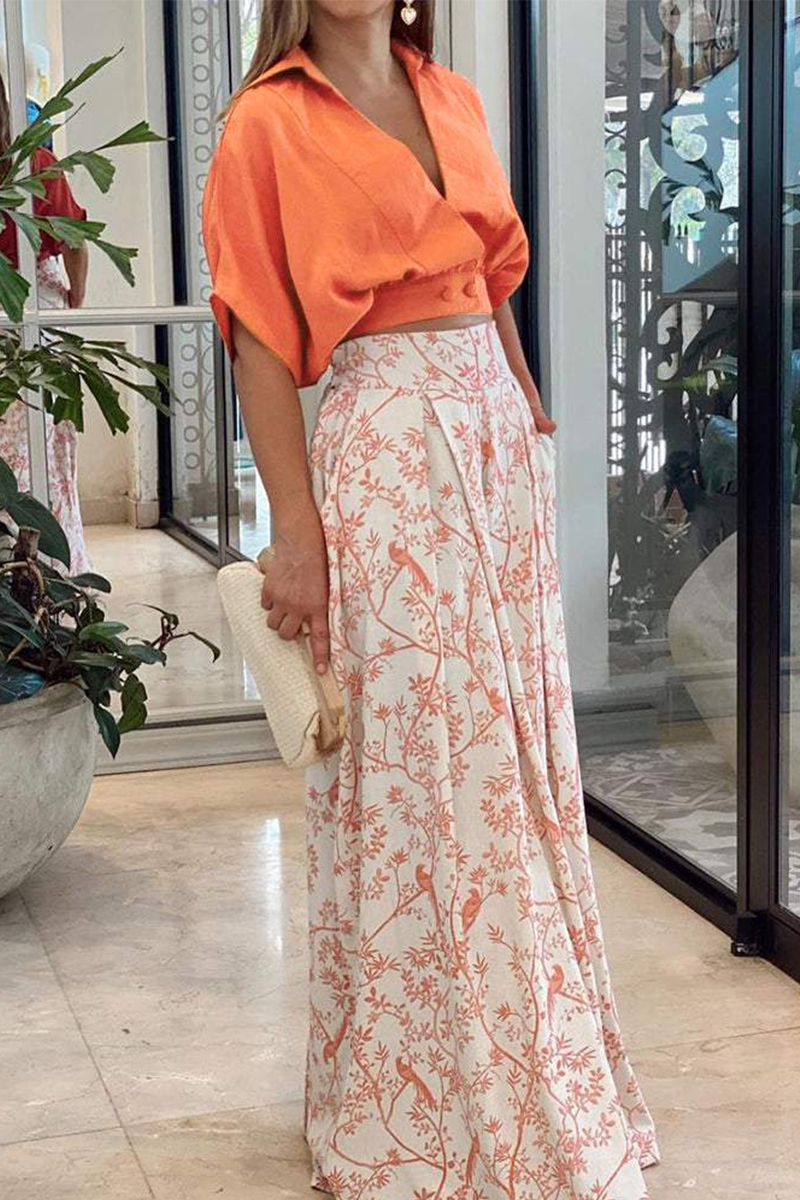 Stijlvolle dames outfit: tweedelige set met trendy pofmouw crop top en flowy palazzo broek voor een modieuze look.