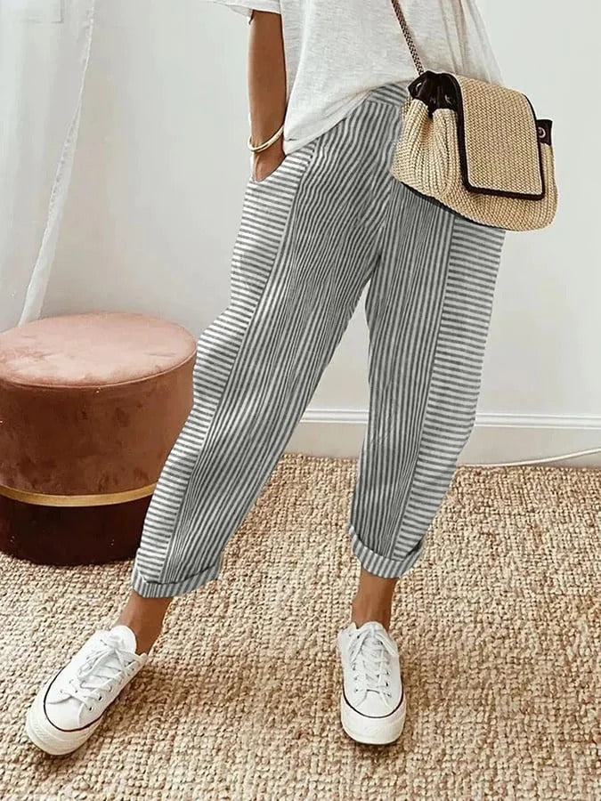 Veelzijdige gestreepte damesbroek met hoge taille en trekkoord. Perfect voor een casual zomerlook op strand of stad.