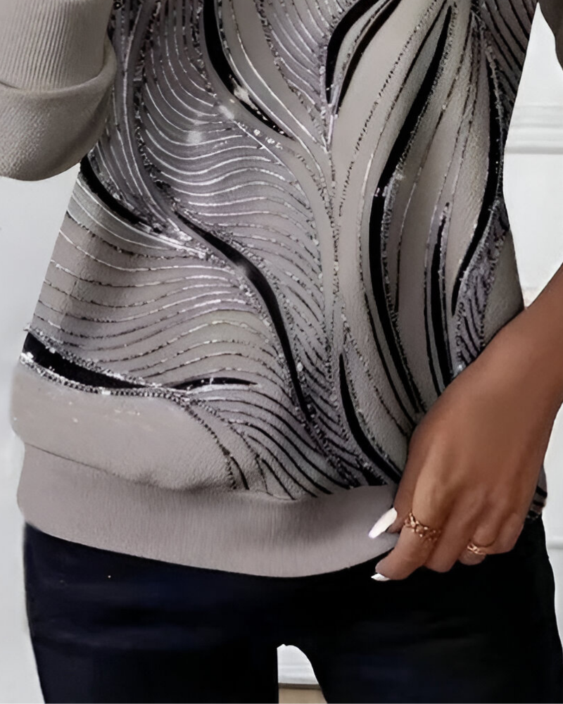Modieuze grijze dames ritstrui met opvallend patroon design. Lange mouwen voor comfort in herfst en winter.