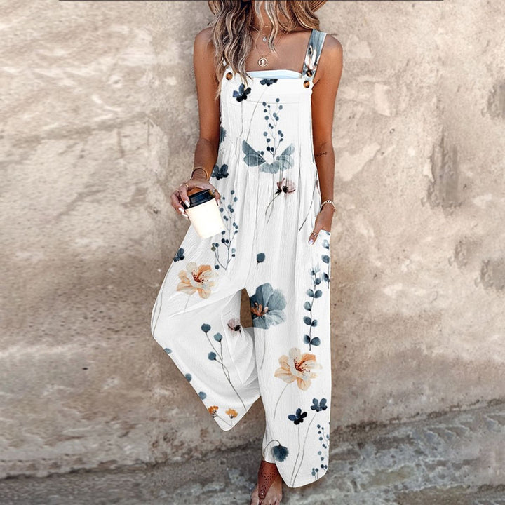 Dames zomer jumpsuit met levendige bloemenprint en wijde, comfortabele pasvorm, perfect voor een zonnige dag.