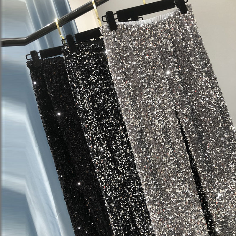 Schitterende zwarte glitterbroek voor dames, met elegante wijde pijpen, onmisbaar voor elke feestoutfit.
