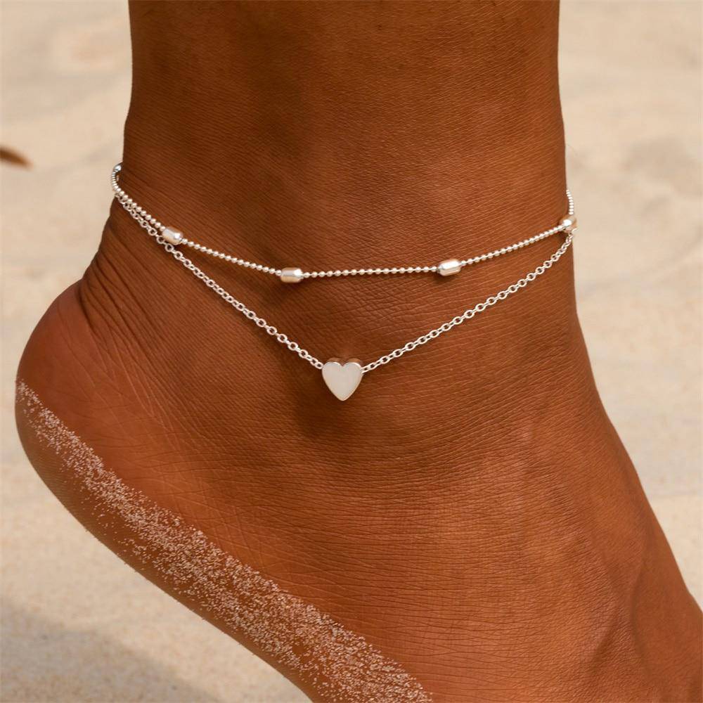 Sierlijk dames enkelbandje met dubbele ketting en charmante hartbedel. Prachtig sterling zilveren sieraad.