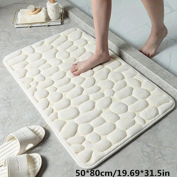 Elegante badmat van polyester; combineert absorptie met antislip functionaliteit.