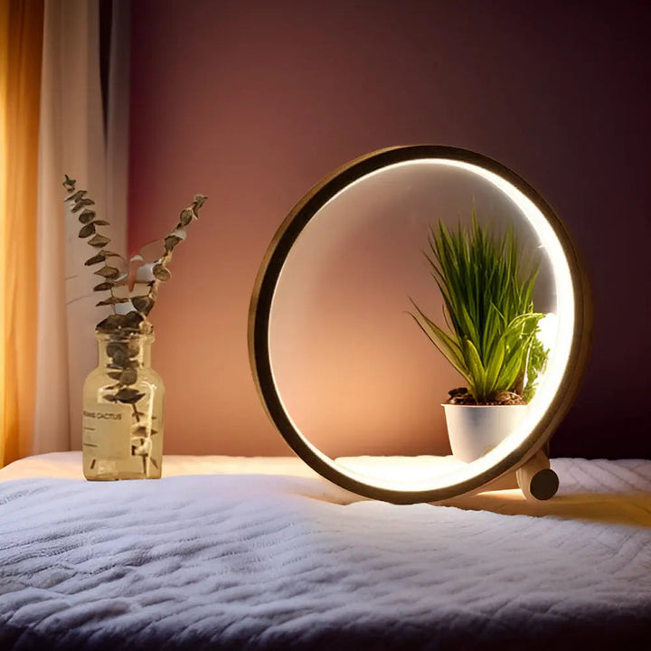 Minimalistische dimbare LED bureaulamp met rond ontwerp, perfect voor modern interieur.