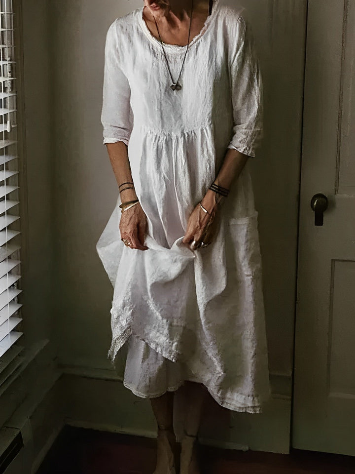 Ademende linnen dames midi jurk met losse pasvorm en ronde hals, ultiem comfort voor de zomer.