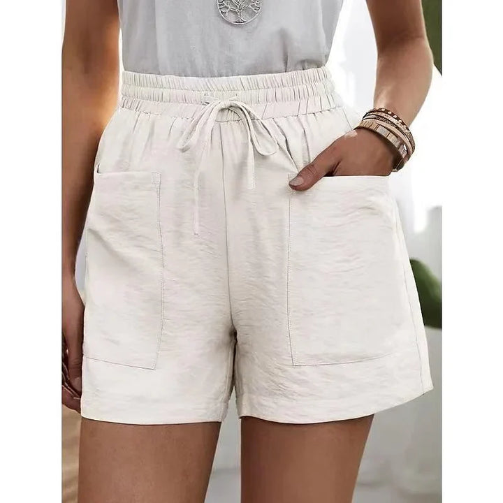 Damesmode: casual korte broek met hoge taille en elastische band. Perfect voor ontspannen zomerse dagen.