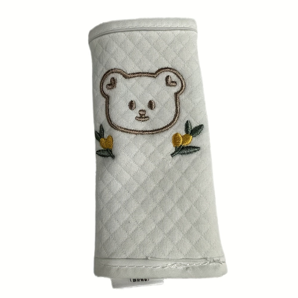 Comfortabele schouderpads met dierenprint, eenvoudig te bevestigen aan kinderwagenriemen voor extra bescherming.