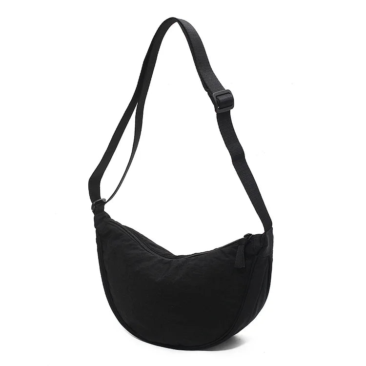 Elegante dames dumpling handtas, een modieus accessoire dat past bij elke outfit.