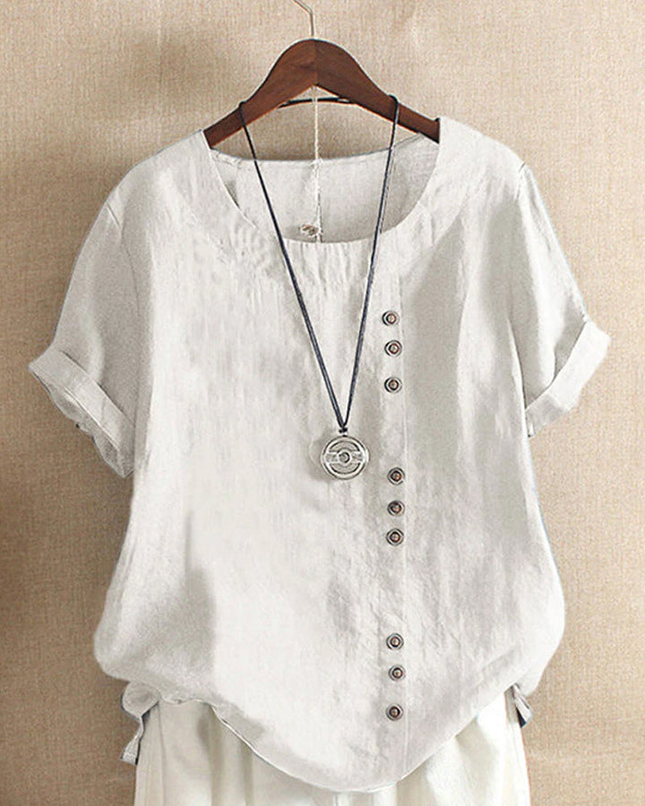 Achteraanzicht van de effen en comfortabele zomerblouse voor dames met korte mouwen.