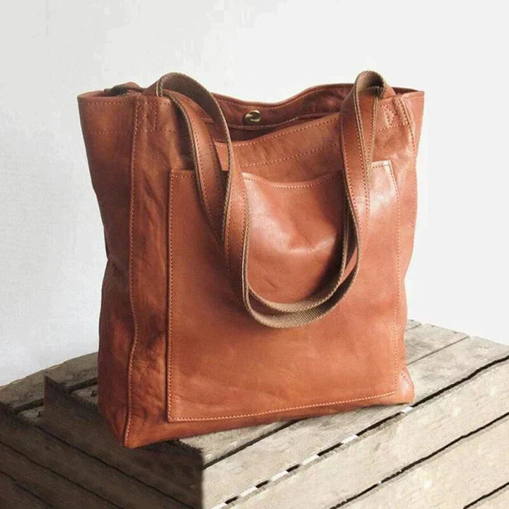 Bruine PU leren dames handtas, tijdloze stijl, ruim voor essentials, ideaal voor dagelijks gebruik.